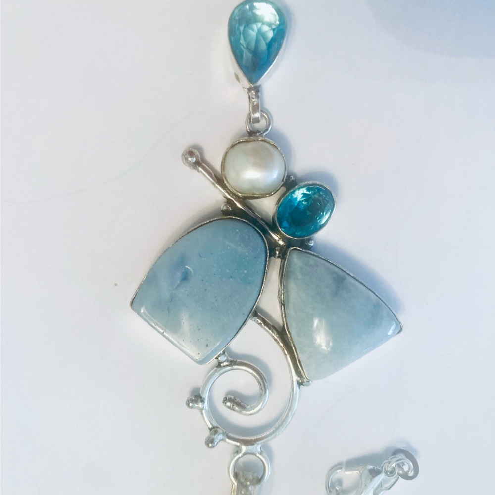 3 inch, Owyhee Opal, Blue Topaz, and Pearl pendant on a silver chain. - Picture 3 of 5